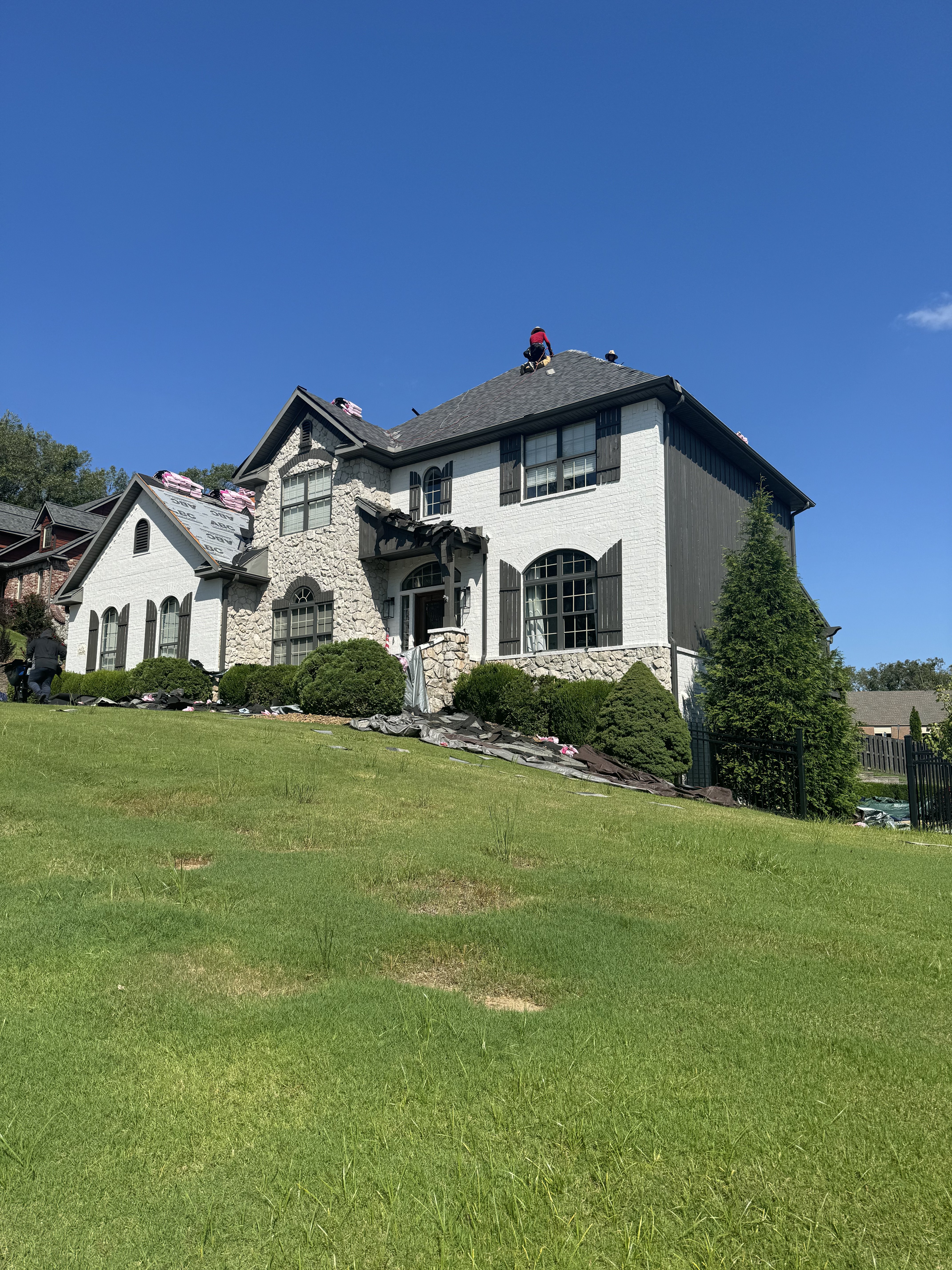 Completed roofing project with drone view