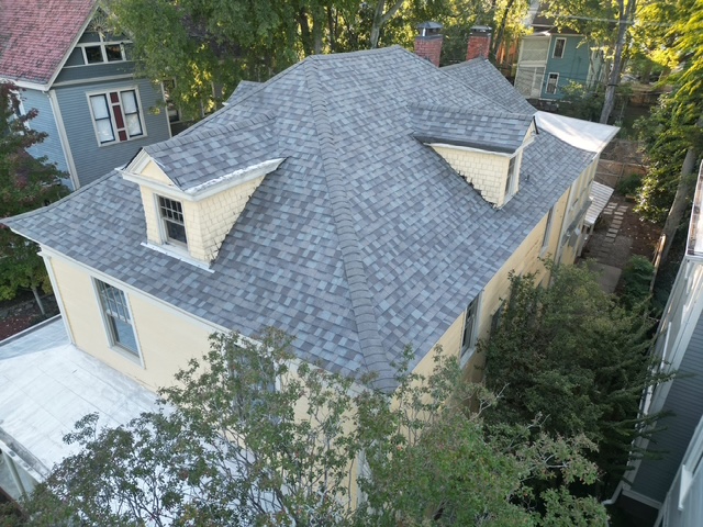 Crew working on large roof installation